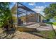 Enjoy outdoor living with a screened patio, pool, and cozy fire pit at 11125 Shelter Cove Loop, New Port Richey, FL 34654