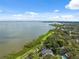 Breathtaking aerial view of waterfront property with lush greenery and views of the bay at 1136 Thayer St, Safety Harbor, FL 34695