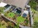 Aerial view of a beautifully landscaped backyard with patio and garden areas at 1136 Thayer St, Safety Harbor, FL 34695