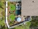 Aerial view of a beautifully landscaped backyard with patio and garden areas at 1136 Thayer St, Safety Harbor, FL 34695