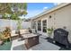 Cozy back patio with comfortable seating and outdoor dining area, perfect for entertaining at 1136 Thayer St, Safety Harbor, FL 34695
