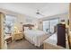 Cozy bedroom with a ceiling fan, natural light, and views of the outdoors at 1136 Thayer St, Safety Harbor, FL 34695
