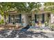 Charming home exterior featuring lush landscaping and inviting curb appeal at 1136 Thayer St, Safety Harbor, FL 34695