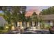 Charming home exterior featuring lush landscaping and inviting curb appeal at 1136 Thayer St, Safety Harbor, FL 34695