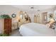 Bright bedroom with white walls, a ceiling fan, and traditional furnishings at 1136 Thayer St, Safety Harbor, FL 34695