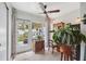 Bright sunroom with tile floors, lots of windows, and access to the backyard at 1136 Thayer St, Safety Harbor, FL 34695