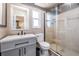 Modern bathroom featuring a sleek vanity, toilet, and glass-enclosed shower at 1403 Tallahassee Dr, Tarpon Springs, FL 34689