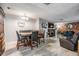 Open-concept dining area with built-in bench seating and convenient access to the living room at 1403 Tallahassee Dr, Tarpon Springs, FL 34689