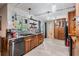 Updated kitchen featuring wooden cabinets, stainless steel appliances, and sleek countertops at 1403 Tallahassee Dr, Tarpon Springs, FL 34689