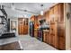 Spacious kitchen boasting ample wood cabinetry, modern appliances, and bright tile flooring at 1403 Tallahassee Dr, Tarpon Springs, FL 34689