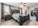 Comfortable bedroom with a large bed, ceiling fan, and views of the closet at 1403 Tallahassee Dr, Tarpon Springs, FL 34689