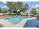 Inviting pool area with a spacious deck, perfect for outdoor entertaining and relaxation at 1403 Tallahassee Dr, Tarpon Springs, FL 34689