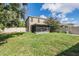 A large backyard and covered patio, great for entertaining and relaxing at 15420 Quail Woods Pl, Ruskin, FL 33573