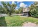 A large backyard and covered patio, great for entertaining at 15420 Quail Woods Pl, Ruskin, FL 33573