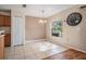 Bright dining area with tile flooring, a pendant light, and natural light at 15420 Quail Woods Pl, Ruskin, FL 33573