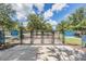 Community dog park with separate areas for large and small dogs, providing a safe and fun environment at 15420 Quail Woods Pl, Ruskin, FL 33573