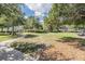 The dog park provides picnic tables, space to roam, and various toys to enrich your pet's outdoor experience at 15420 Quail Woods Pl, Ruskin, FL 33573