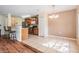 Open kitchen with stainless appliances, granite countertops, and tile flooring at 15420 Quail Woods Pl, Ruskin, FL 33573