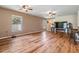 Large living area with hardwood floors, ceiling fans and plenty of space at 15420 Quail Woods Pl, Ruskin, FL 33573
