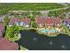 Stunning aerial view of resort-style condo community with pool, landscaping, and beautiful water features at 1640 Villa Capri Cir # 206, Odessa, FL 33556