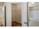 Bright bathroom area with an open closet and a bathtub at 1640 Villa Capri Cir # 206, Odessa, FL 33556