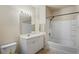 Neutral bathroom featuring a white shower-tub combination and a vanity sink with a large mirror at 1640 Villa Capri Cir # 206, Odessa, FL 33556