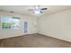 Comfortable bedroom featuring natural light, ceiling fan, and neutral colored carpet at 1640 Villa Capri Cir # 206, Odessa, FL 33556