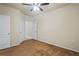 Well-lit bedroom with two doors and neutral-toned walls and carpet at 1640 Villa Capri Cir # 206, Odessa, FL 33556