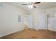 Spacious bedroom with neutral walls and ceiling fan, leading to additional rooms at 1640 Villa Capri Cir # 206, Odessa, FL 33556