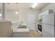 Bright kitchen offering white appliances, ample countertop space, and a serving counter to the living area at 1640 Villa Capri Cir # 206, Odessa, FL 33556