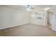 Bright living room with neutral tones, open layout, and a ceiling fan at 1640 Villa Capri Cir # 206, Odessa, FL 33556