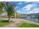 View of an apartment community pond with fountain, landscaping, and building exteriors at 1640 Villa Capri Cir # 206, Odessa, FL 33556