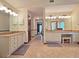 Spacious bathroom with dual sinks, vanity, tile flooring, and well-lit mirrors at 1810 Tamerlane Pl, Brandon, FL 33510