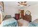 Bedroom features 2 twin beds, ceiling fan, carpet floors and classic wood furniture at 1810 Tamerlane Pl, Brandon, FL 33510