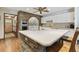 Well lit kitchen with stainless steel appliances, white cabinets, a brick island, and eat-in breakfast bar at 1810 Tamerlane Pl, Brandon, FL 33510