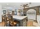 Spacious kitchen featuring brick accents, a breakfast bar, and modern appliances, perfect for cooking and entertaining at 1810 Tamerlane Pl, Brandon, FL 33510