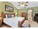 Comfortable main bedroom features wood furnishings and a view to the connected bathroom at 1810 Tamerlane Pl, Brandon, FL 33510