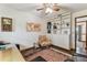 Office featuring wood floors, world maps, ceiling fan and ample storage space at 1810 Tamerlane Pl, Brandon, FL 33510