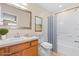 Bathroom featuring a vanity, toilet, and a shower-tub combo with blue shower curtain at 2020 Greenwood Valley Dr, Plant City, FL 33563
