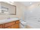 Bathroom featuring a vanity, toilet, and a shower-tub combo with white tile surround at 2020 Greenwood Valley Dr, Plant City, FL 33563