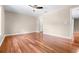 Spacious empty bedroom featuring sleek wood floors and natural light with neutral walls at 2020 Greenwood Valley Dr, Plant City, FL 33563