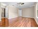 Spacious bedroom boasting sleek wood floors, a ceiling fan, and neutral walls for a modern aesthetic at 2020 Greenwood Valley Dr, Plant City, FL 33563