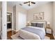 Cozy bedroom with hardwood floors, neutral paint, and a ceiling fan at 2020 Greenwood Valley Dr, Plant City, FL 33563