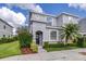 Charming two-story home featuring decorative stone accents and lush landscaping at 2020 Greenwood Valley Dr, Plant City, FL 33563