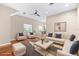 A beautifully staged living room features an oversized couch, soft lighting, and modern accents at 2020 Greenwood Valley Dr, Plant City, FL 33563