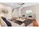 Comfortably staged living room with inviting sofa and soft neutral tones at 2020 Greenwood Valley Dr, Plant City, FL 33563