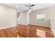 A spacious living room area with shiny hardwood floors and natural light at 2020 Greenwood Valley Dr, Plant City, FL 33563