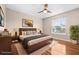 Bedroom with sleek wood floors, natural light, and modern decor provides a cozy and inviting atmosphere at 2020 Greenwood Valley Dr, Plant City, FL 33563