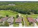 An aerial view shows the home's location near a green golf course and neighborhood at 25950 Risen Star Dr, Wesley Chapel, FL 33544