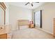 A charming bedroom features neutral carpet, light wood furniture, and a window at 25950 Risen Star Dr, Wesley Chapel, FL 33544